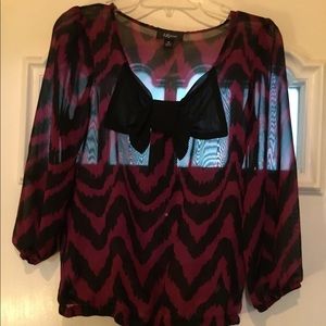 Cute chevron top with bow tie accent.